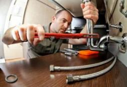 a Kent plumber is installing a sink